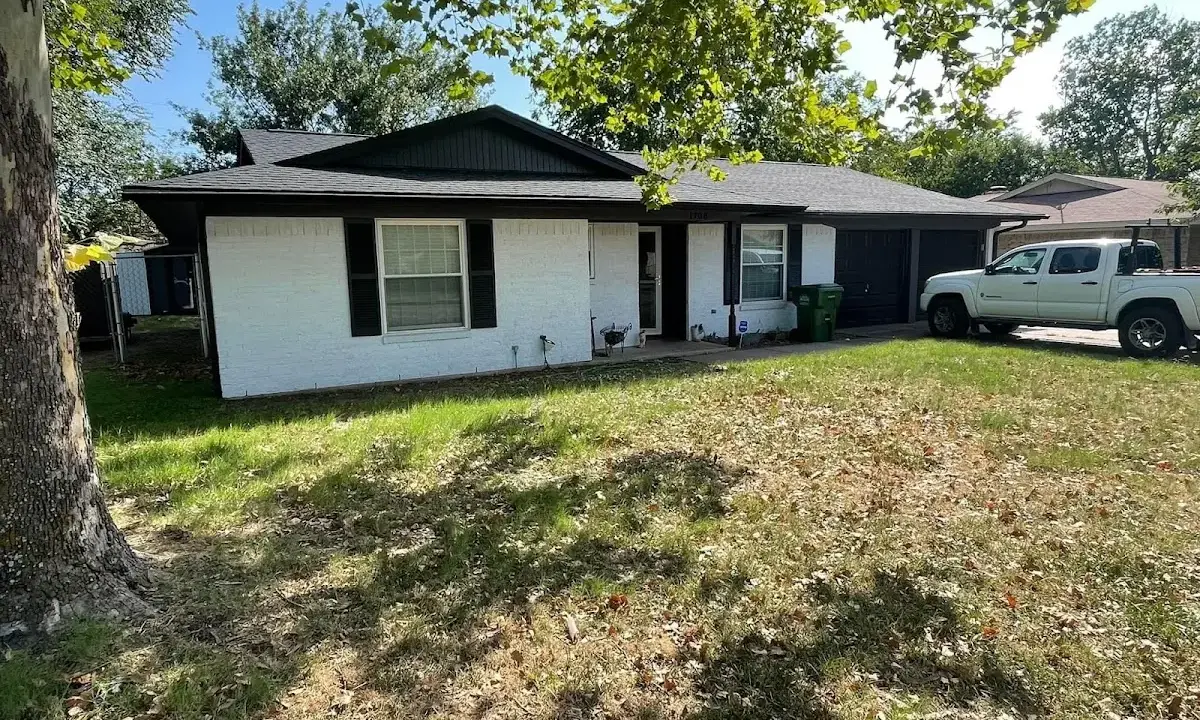 Professional roofing crew working on a residential roof in Temple